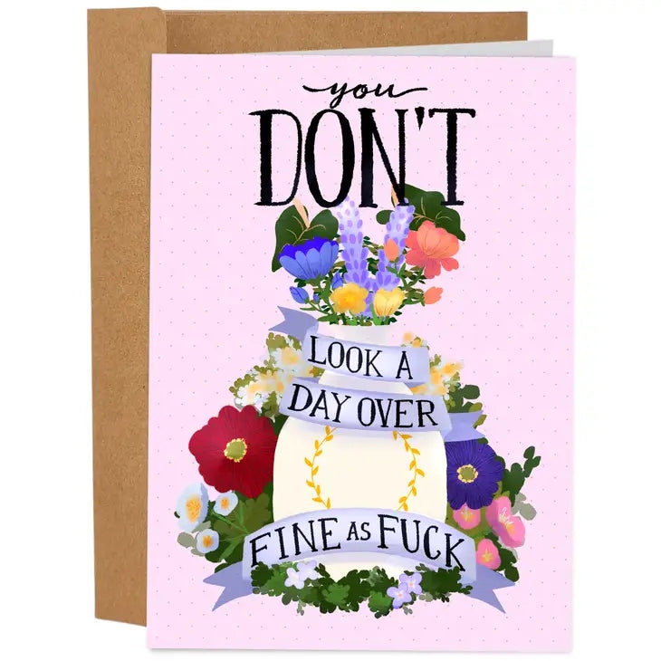 pink dotted birthday card with a lush bouquet decorated with ribbons. all-over text (including on the ribbons) reads "you don't look a day over fine as fuck"