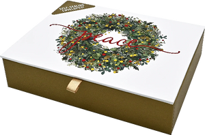 gold product box with a white cover. on it is a wreath with the word peace written in a cursive red font. peter pauper product